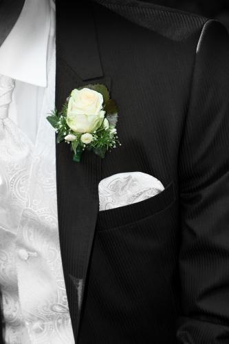 Groom with formalwear and flower on lapel